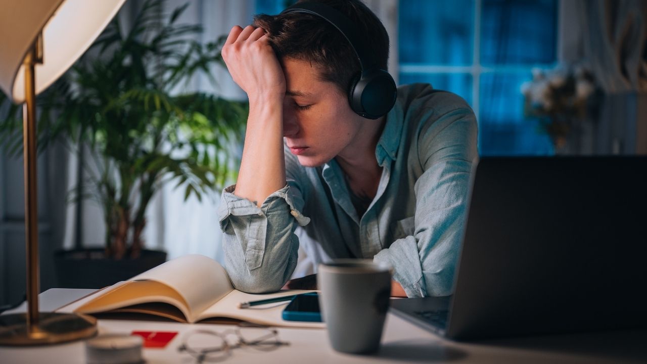 a man with headphones on- Mental Load Burnout