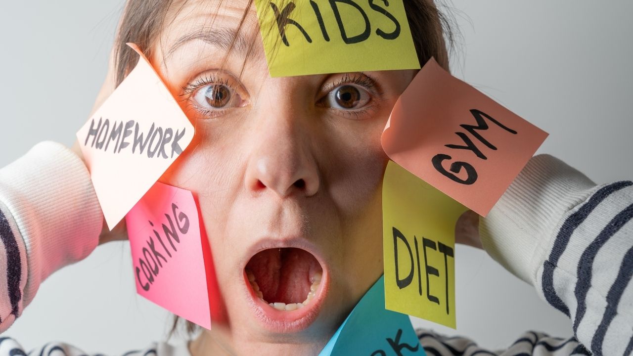 mental load - a woman with many sticky notes on her face